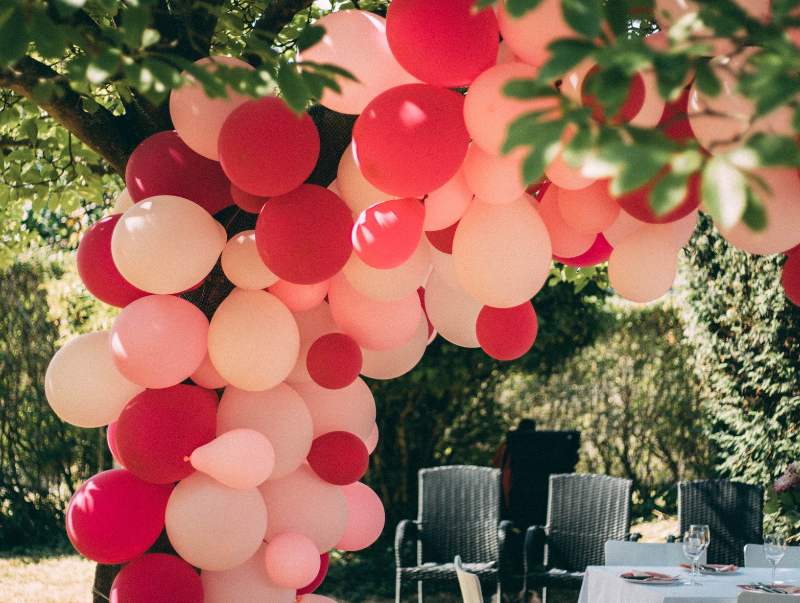 A balloon arch in shades of pink