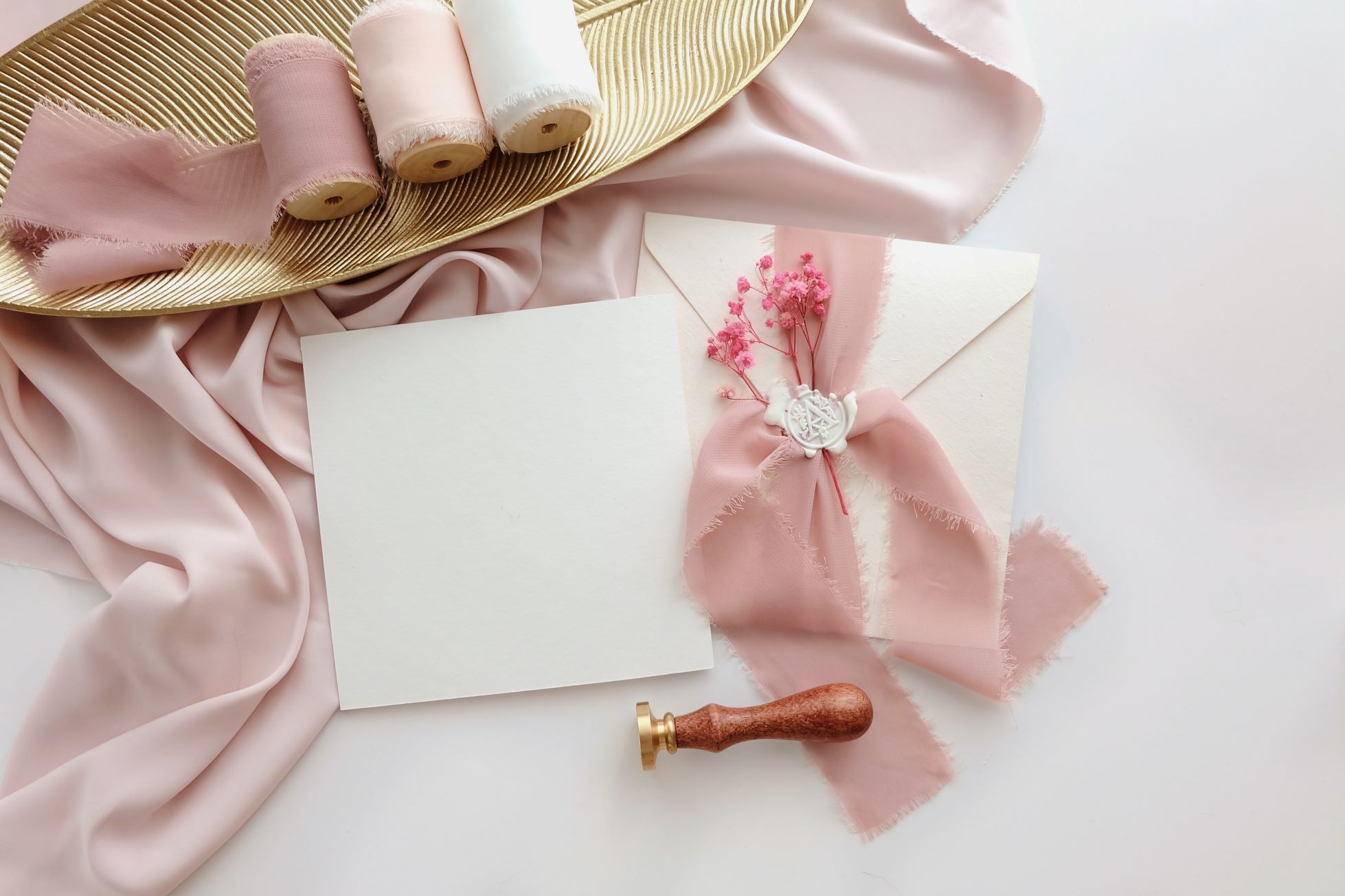 blank wedding invitations with pink fabrics