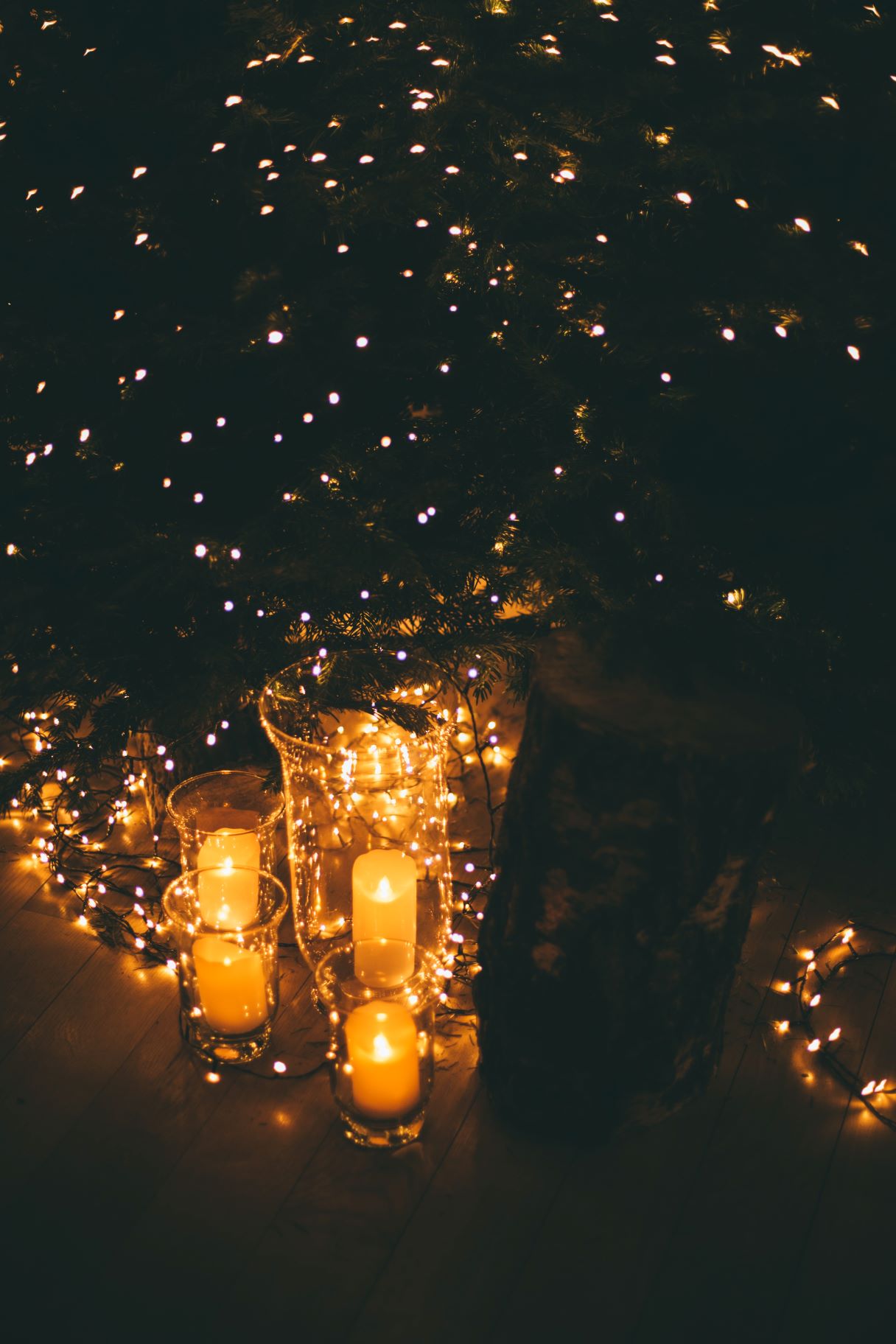 DIY wedding centerpieces with candles and fairy lights.