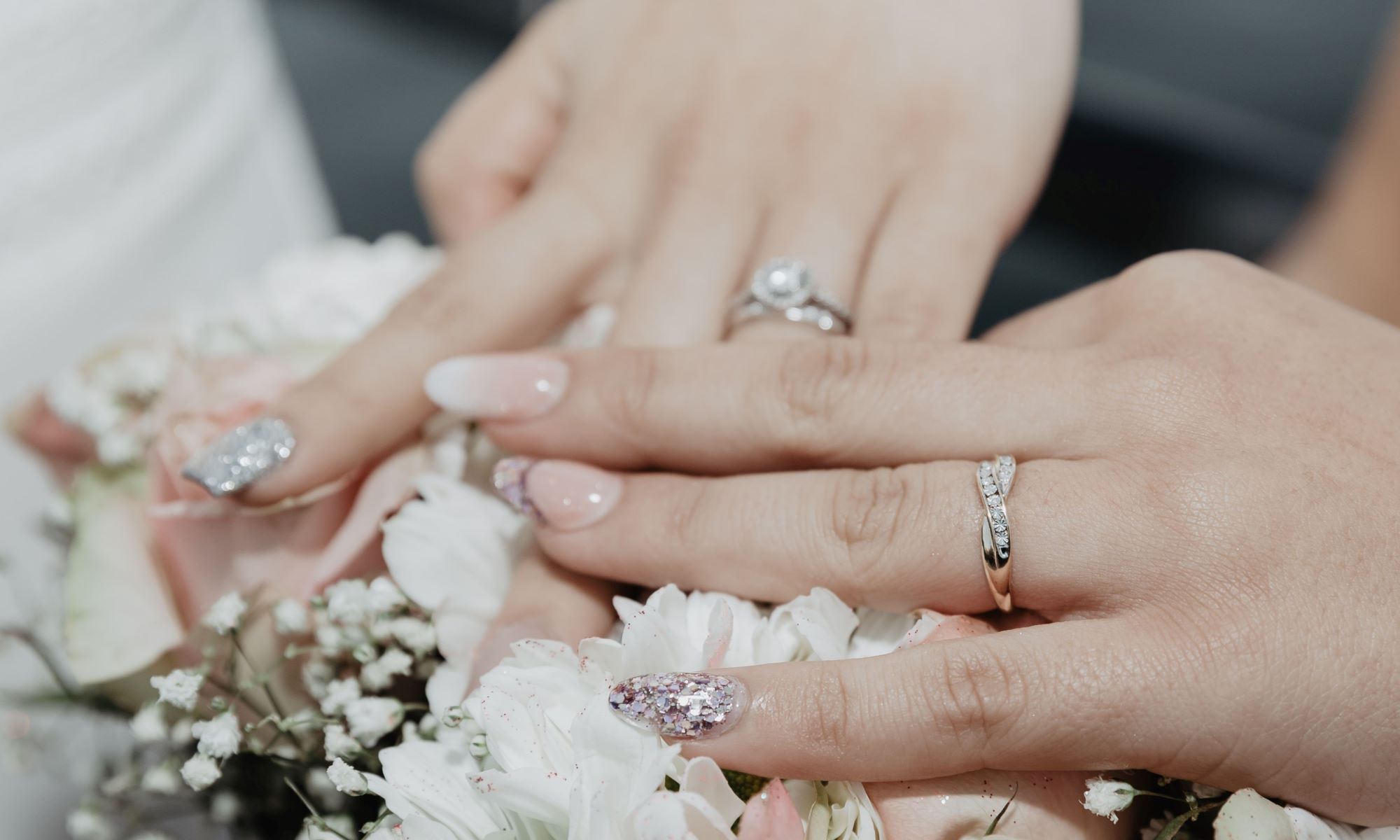 DIY wedding nails. Bride hands and rings.
