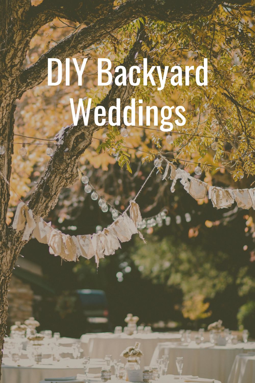 DIY backyard wedding with tables and swags.