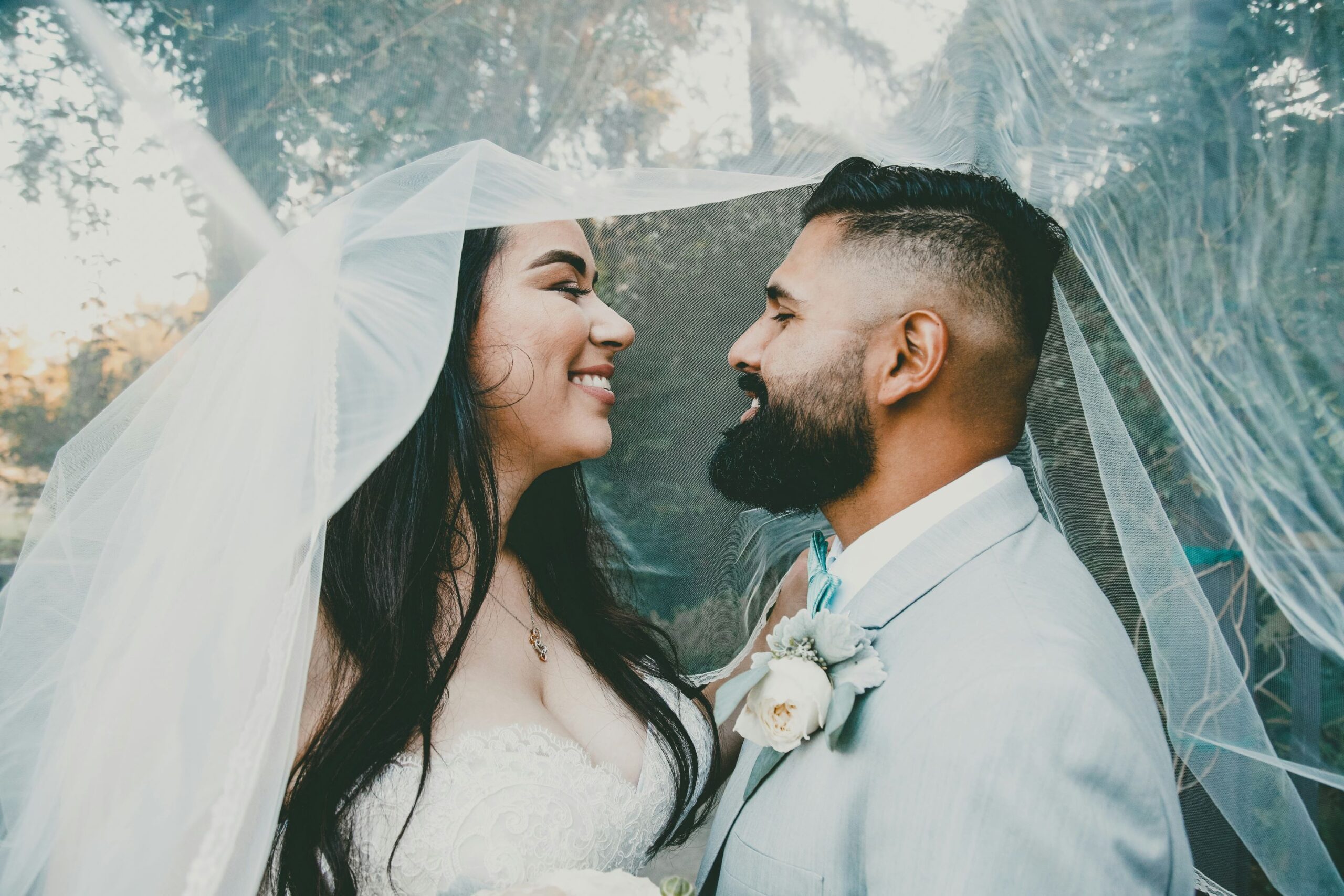 couple with wedding veil or cape