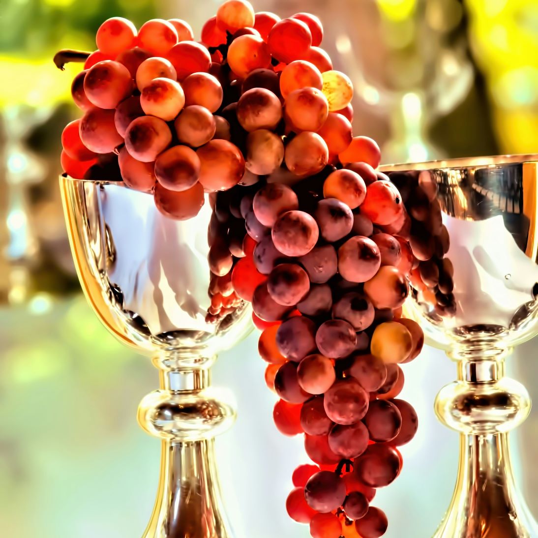 Gold cups with red grapes. 